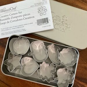 The Pampered Chef Creative Cutters Set #1095 in tin - 8 shapes, approx 1.5”
